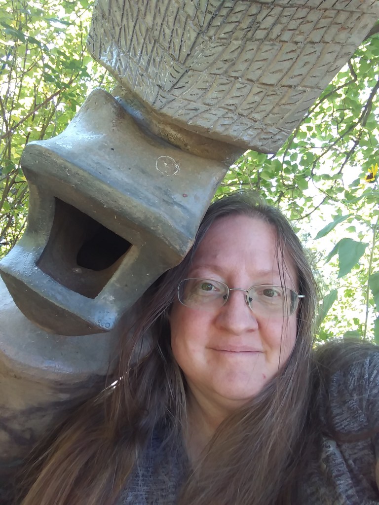 Selfie of the author with one of her mother's sculptures.  That's right, I'm the one on the left...